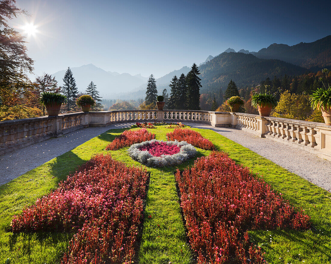 Flower beds in the garden with view of mountains, Linderhof castle, Bavaria, Germany, Europe