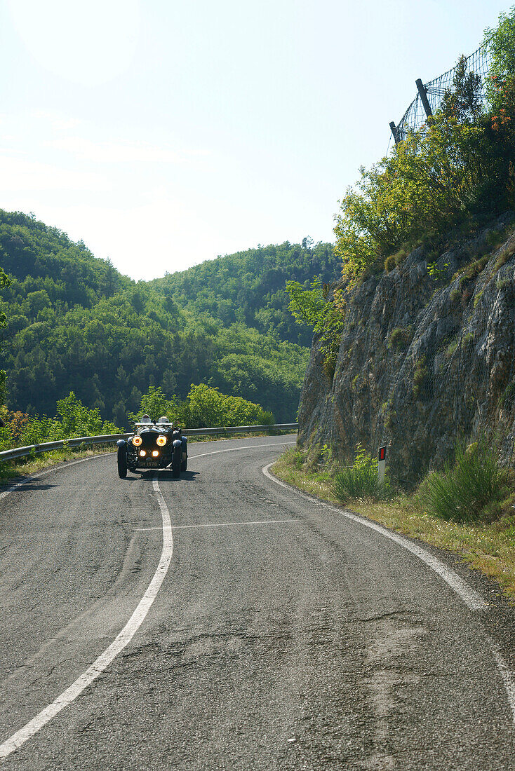 Vintage car on a country road, Spoleto, Umbria, Italy, Europe