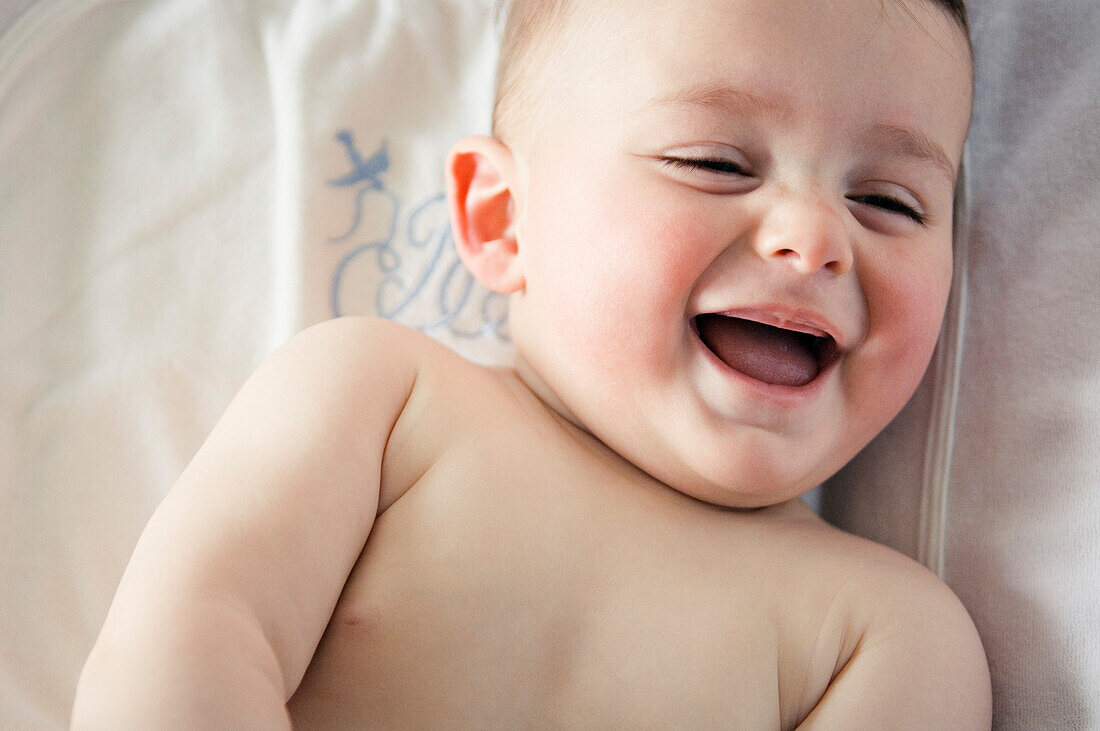 Portrait of a baby laughing