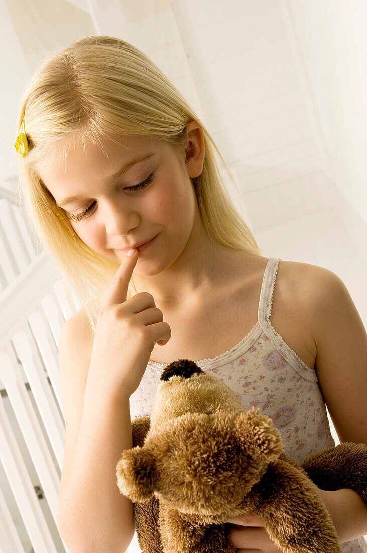 Girl holding a teddy bear