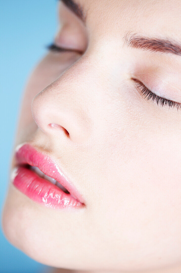 Young woman with eyes closed, close-up