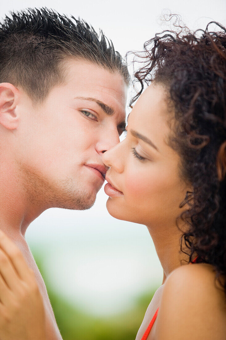 Close-up of a couple about to kiss