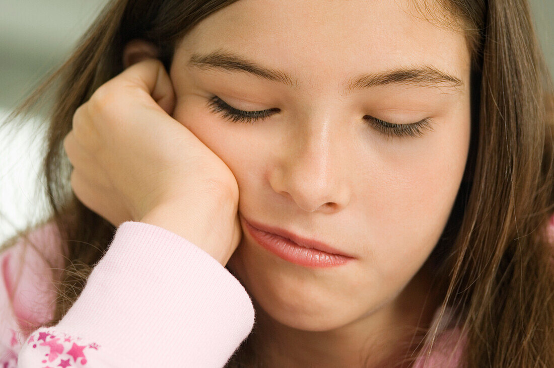 Close-up of a girl thinking