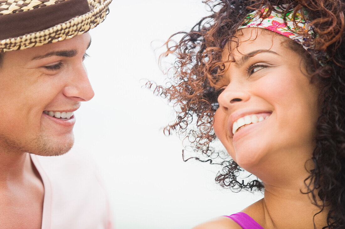 Close-up of a couple smiling at each other