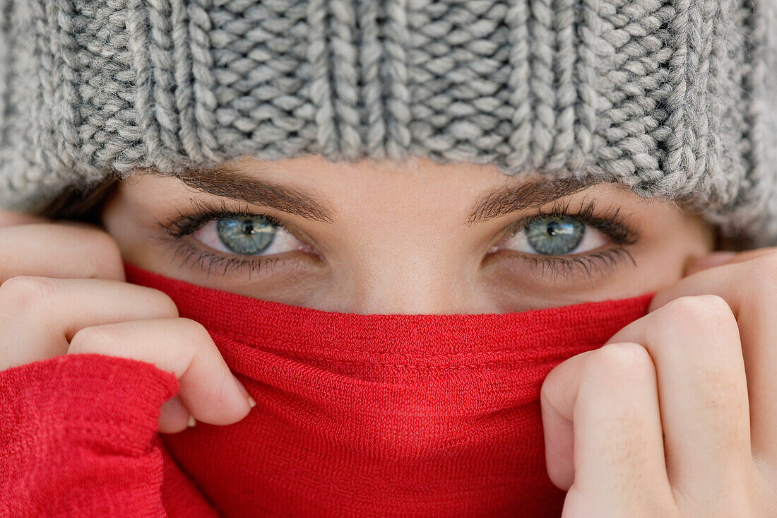 Portrait of a woman covering her face