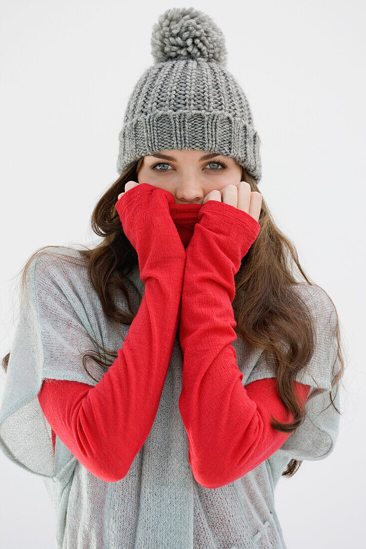 Portrait of a woman covering her face