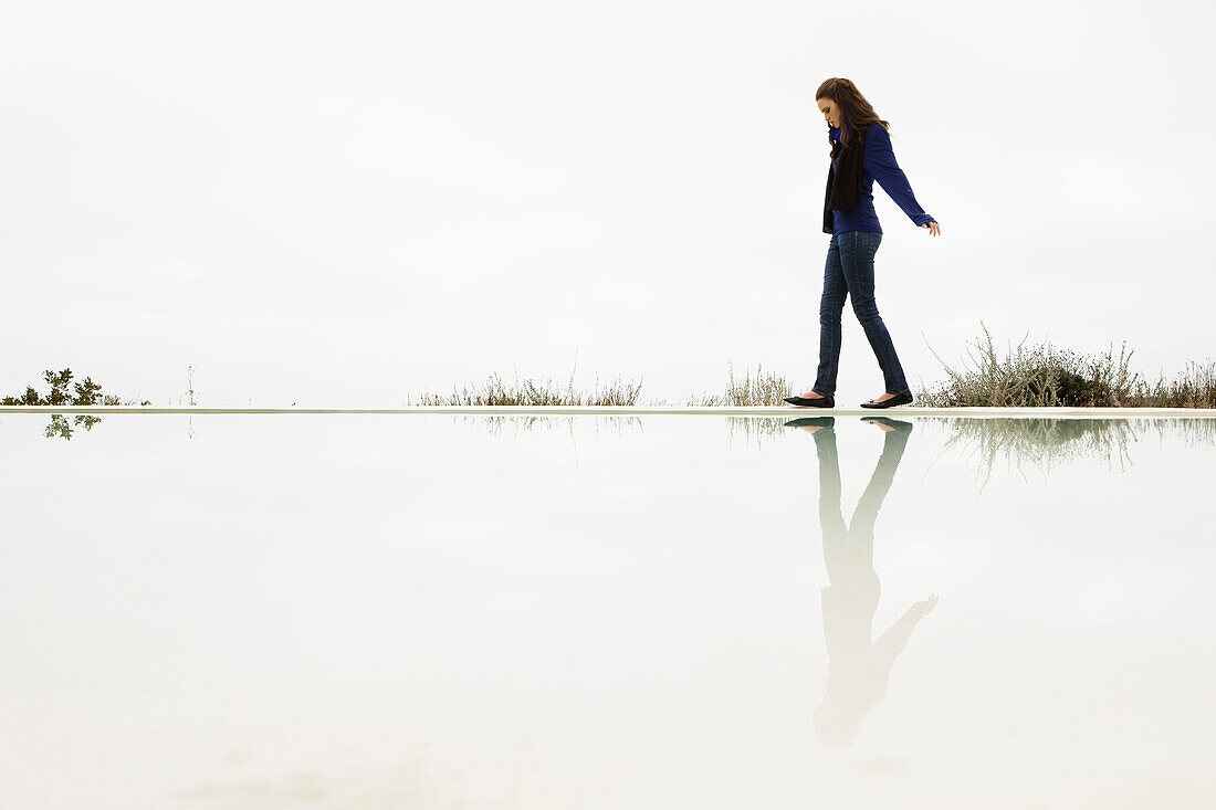 Woman walking at the poolside