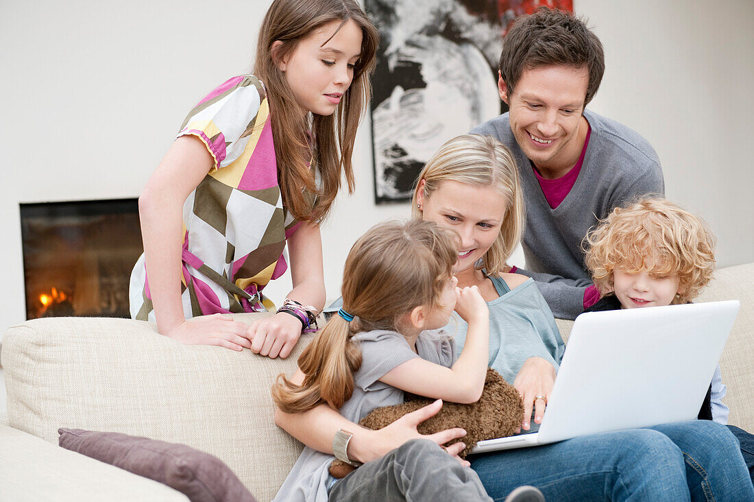 Family using a laptop
