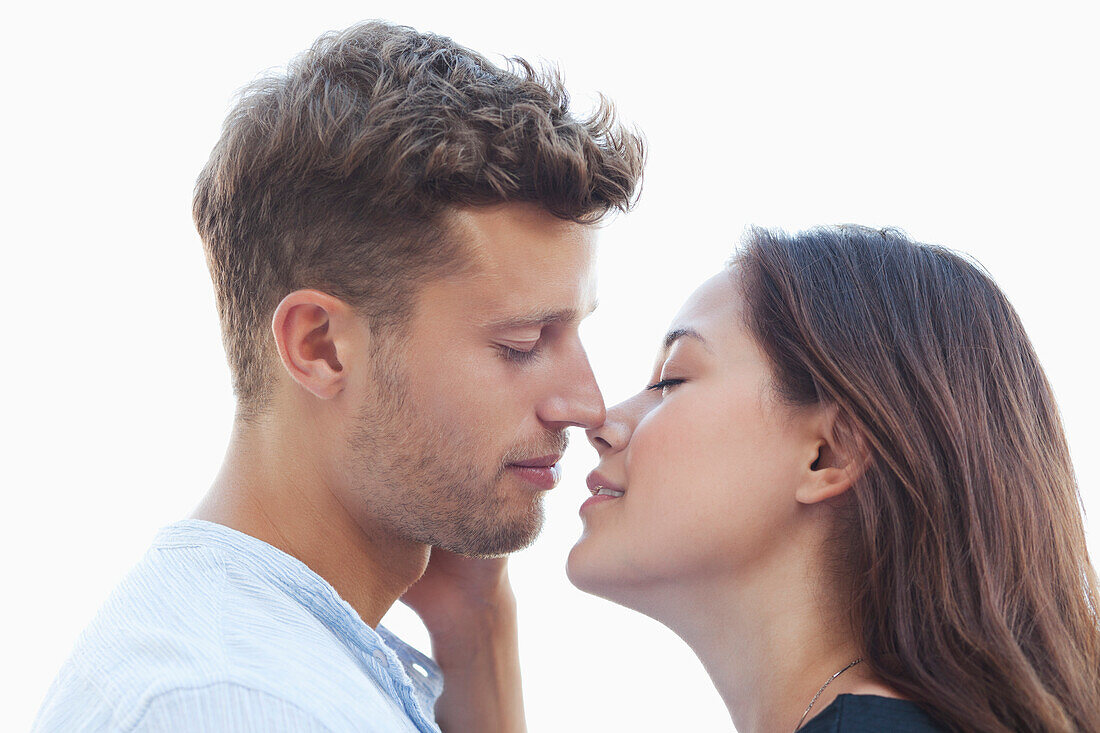 Young couple about to kiss each other