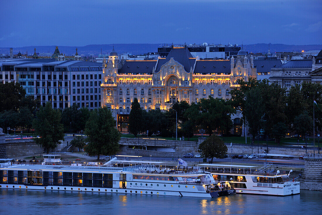 Steam ship on Danube river and Gresham Palace in the evening, Budapest, Hungary, Europe