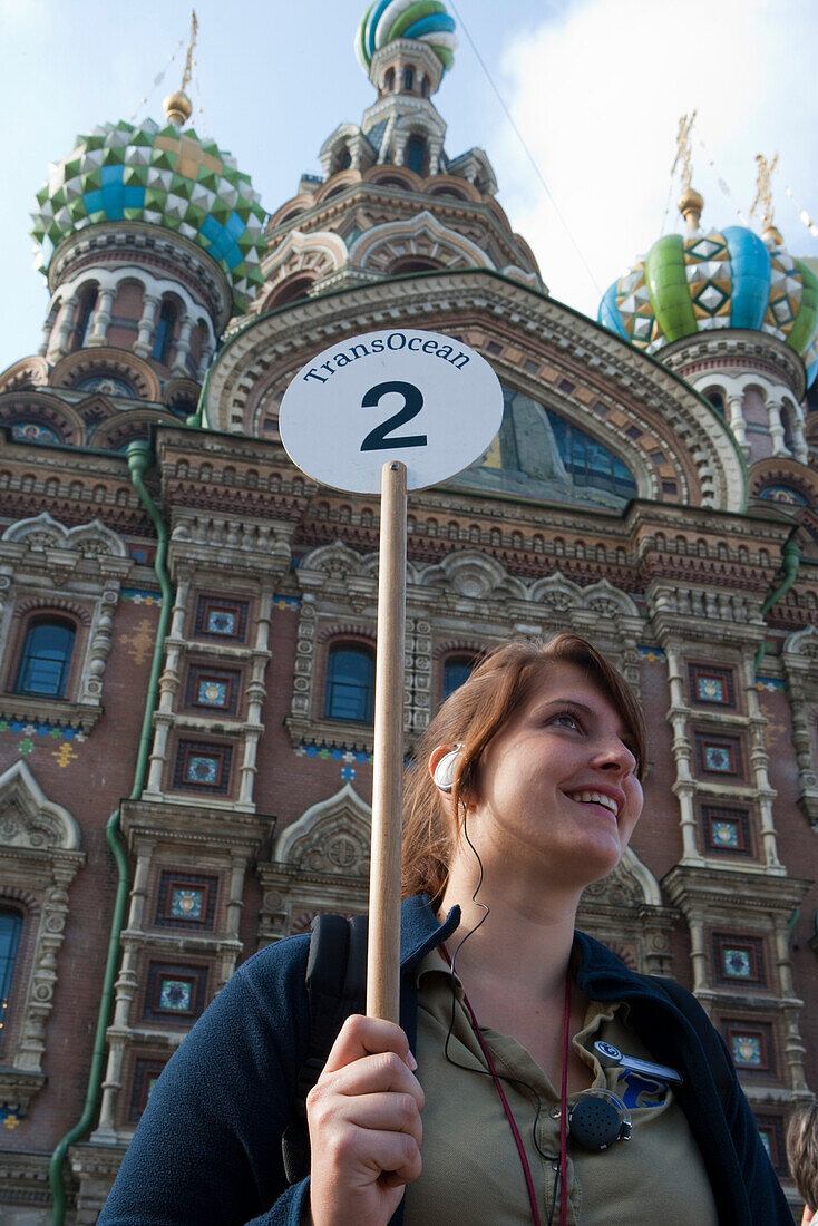 Friendly cruise ship MS Astor (Transocean Kreuzfahrten) tour guide outside Church of the Savior on Spilled Blood (Church of the Resurrection), St. Petersburg, Russia