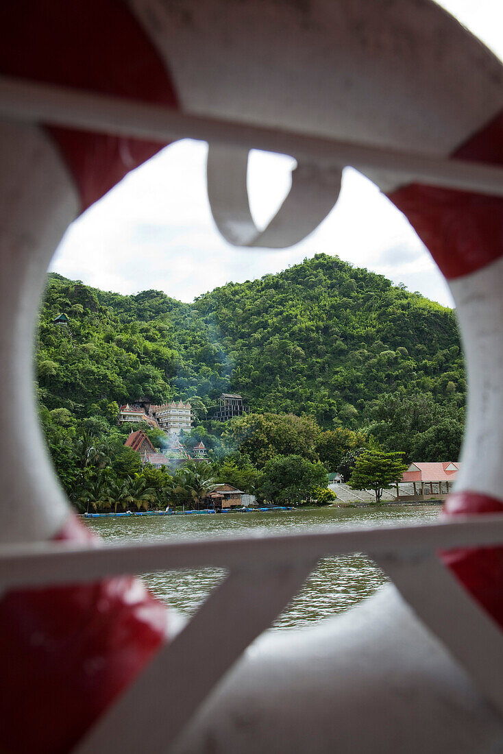 Chinese temple with dragon staircase along River Kwai Noi seen through lifering of river cruise ship RV River Kwai (Cruise Asia Ltd.), near Kanchanaburi, Thailand