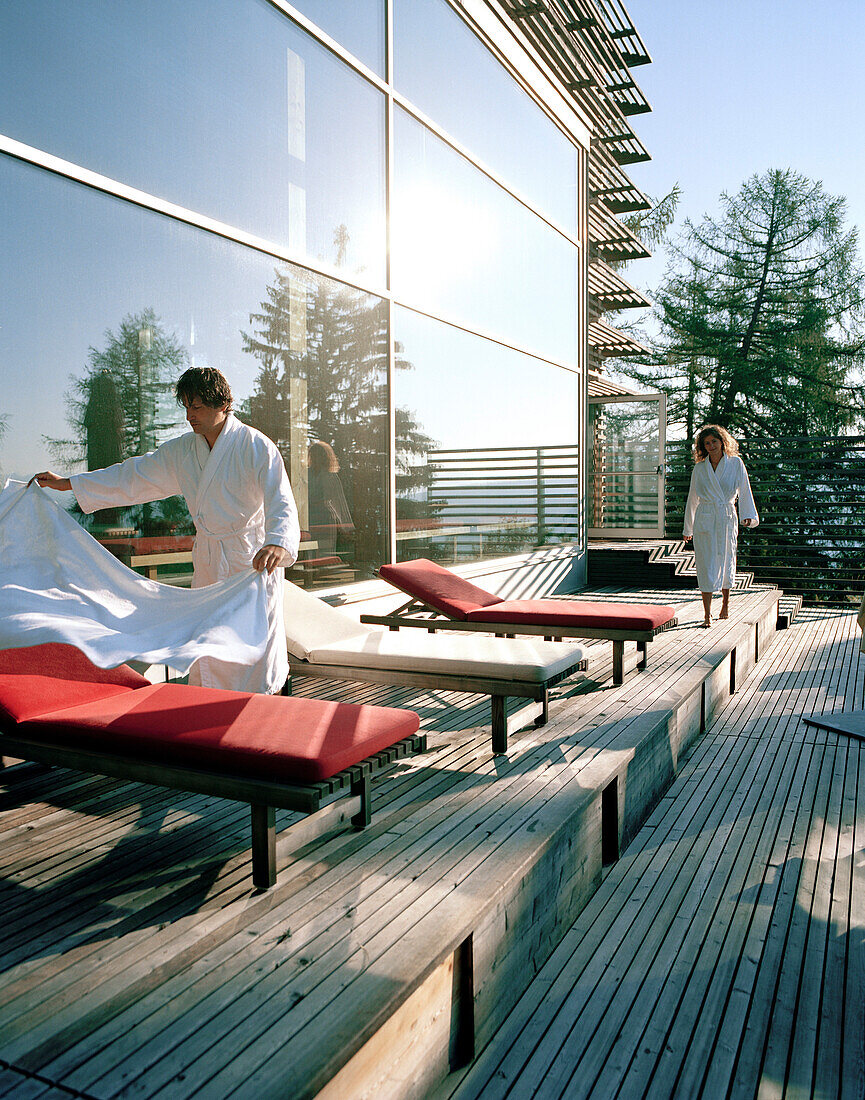 Hotel guests on sun deck, Vigilius Mountain Resort, Vigiljoch, Lana, Trentino-Alto Adige/Suedtirol, Italy