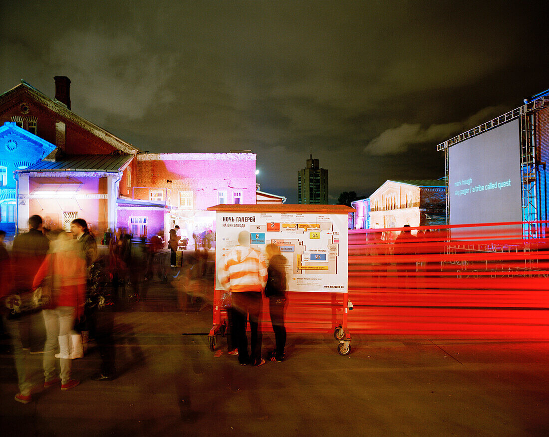 Installations and visitors at the Night of the Open Museum, in front of former spirits factory Winzavod Center for Contemporary Art, Moscow, Russia, Europe