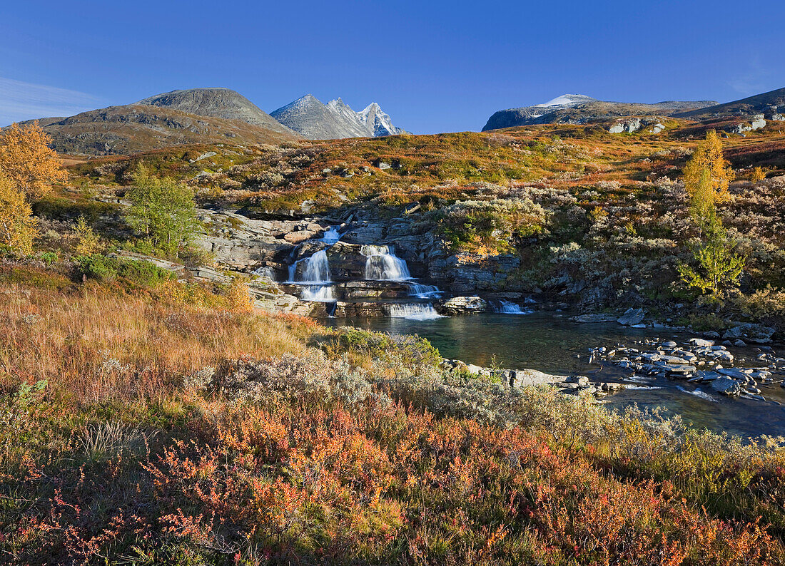 River in autumnal landscape, Hurrungane, Jotunheimen National Park, Hurrungane, Norway, Europe