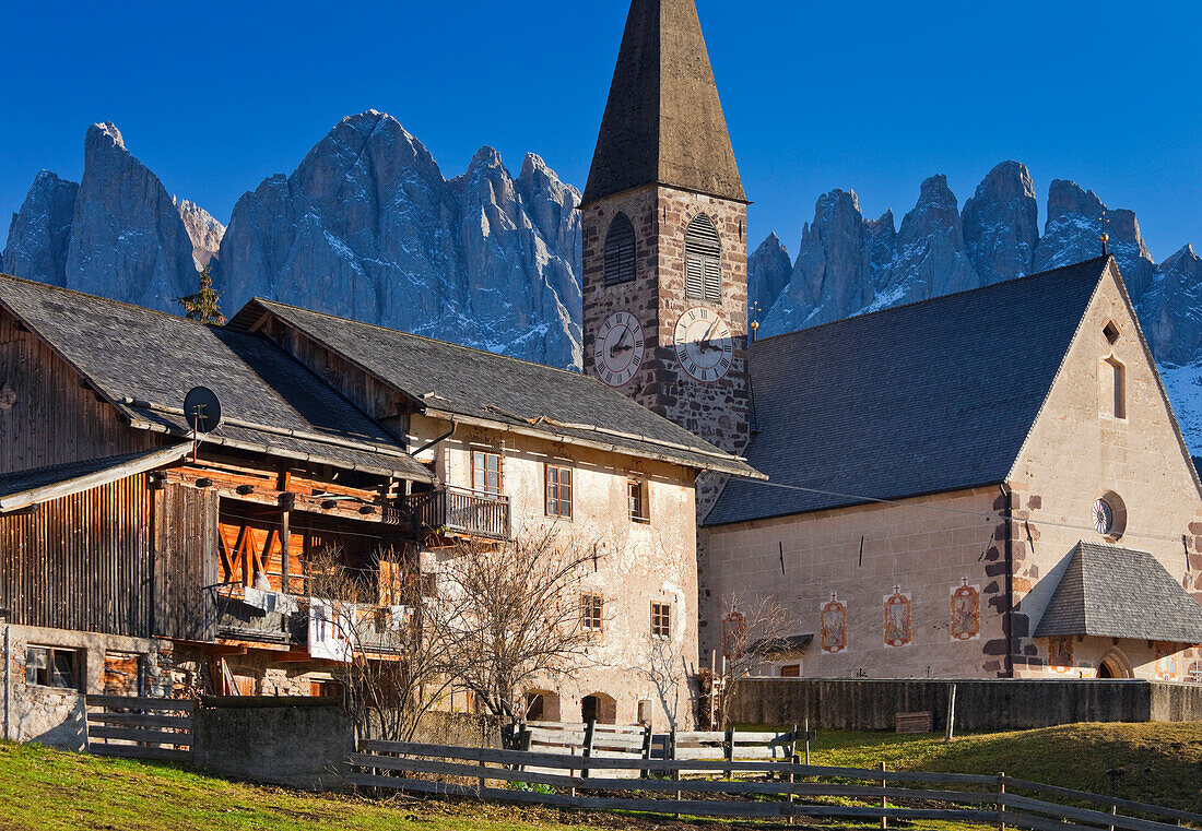 Church of St. Magdalena, Geisler mountains in the background, Villnoss valley, Dolomites, South Tyrol, Italy