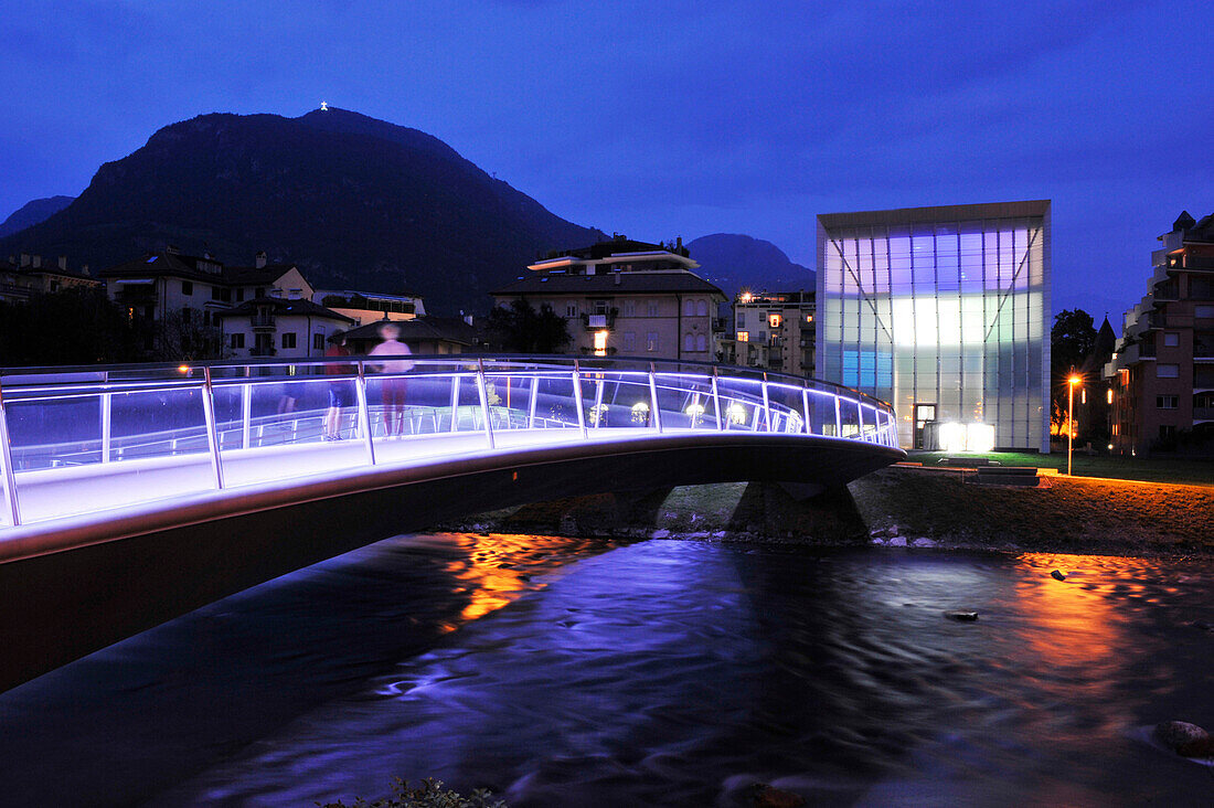 Illuminated bridge in front of museum at night, Bolzano, South Tyrol, Alto Adige, Italy, Europe