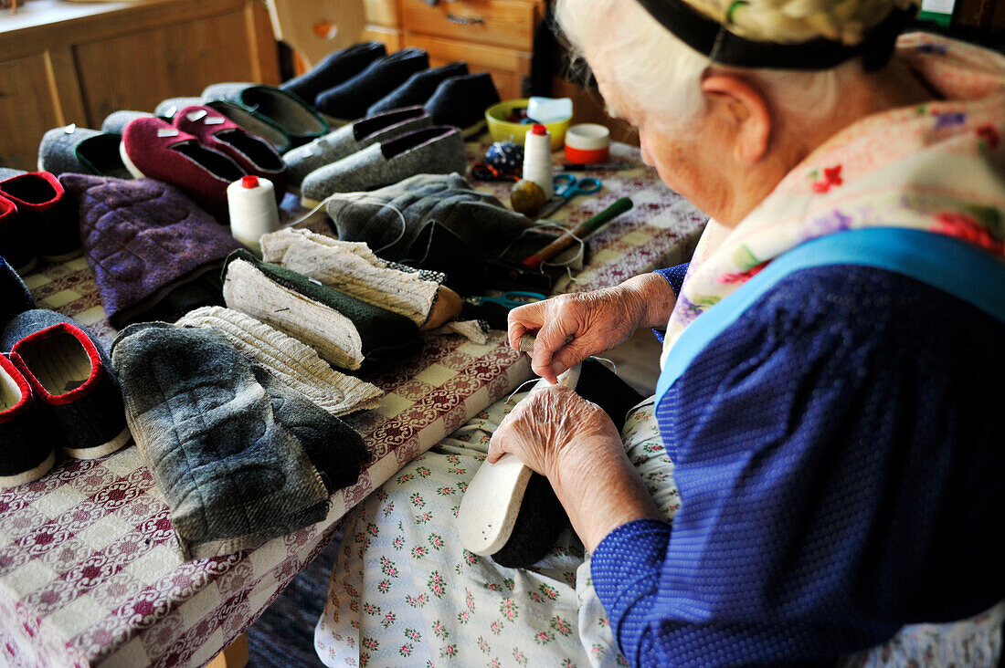 Old woman manufacturing slippers, Durnholz, Val Sarentino, South Tyrol, Alto Adige, Italy, Europe