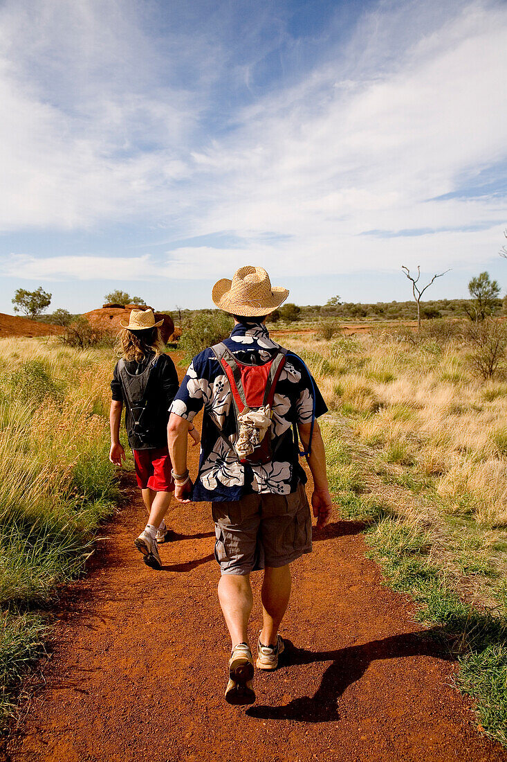 Two men walking in bushland, Rear View, Northern Territory, Australia