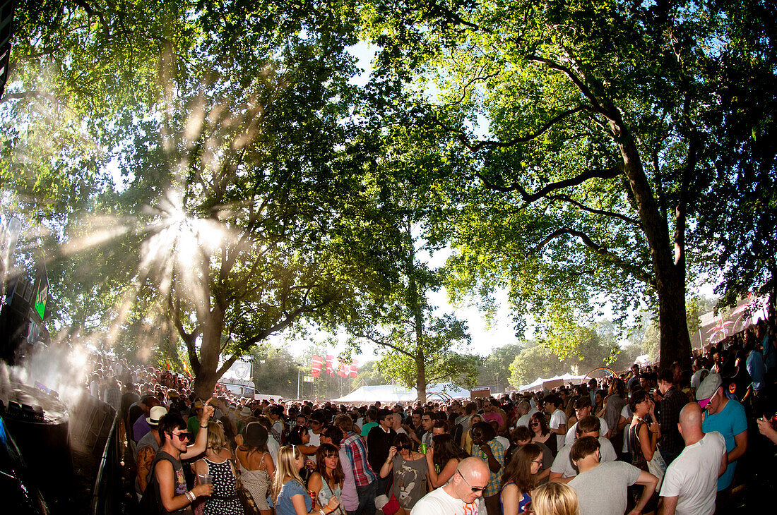 Rays Of Sunlight Coming Through The Trees Over Clubbers At Lovebox Festival In Victoria Park, Victoria Park, London, Uk