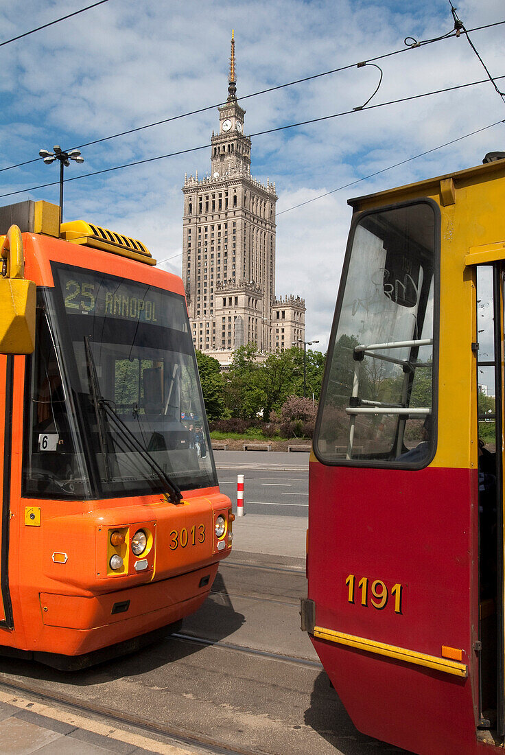 Trams passing the Communist era built Palace of Culture and Science building, Warsaw, Poland