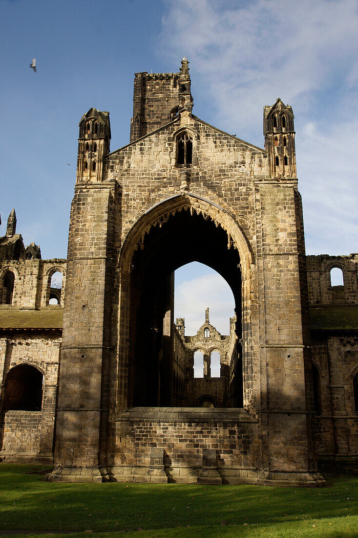 Exterior view of Kirkstall Abbey, Leeds, West Yorkshire, England.  Kirkstall Abbey is one of the countrys largest ruined Cistercian Monastaries, dating from the 12th Century.  It is now a museum. Kirkstall Abbey was often painted by the artist JMW Turner.