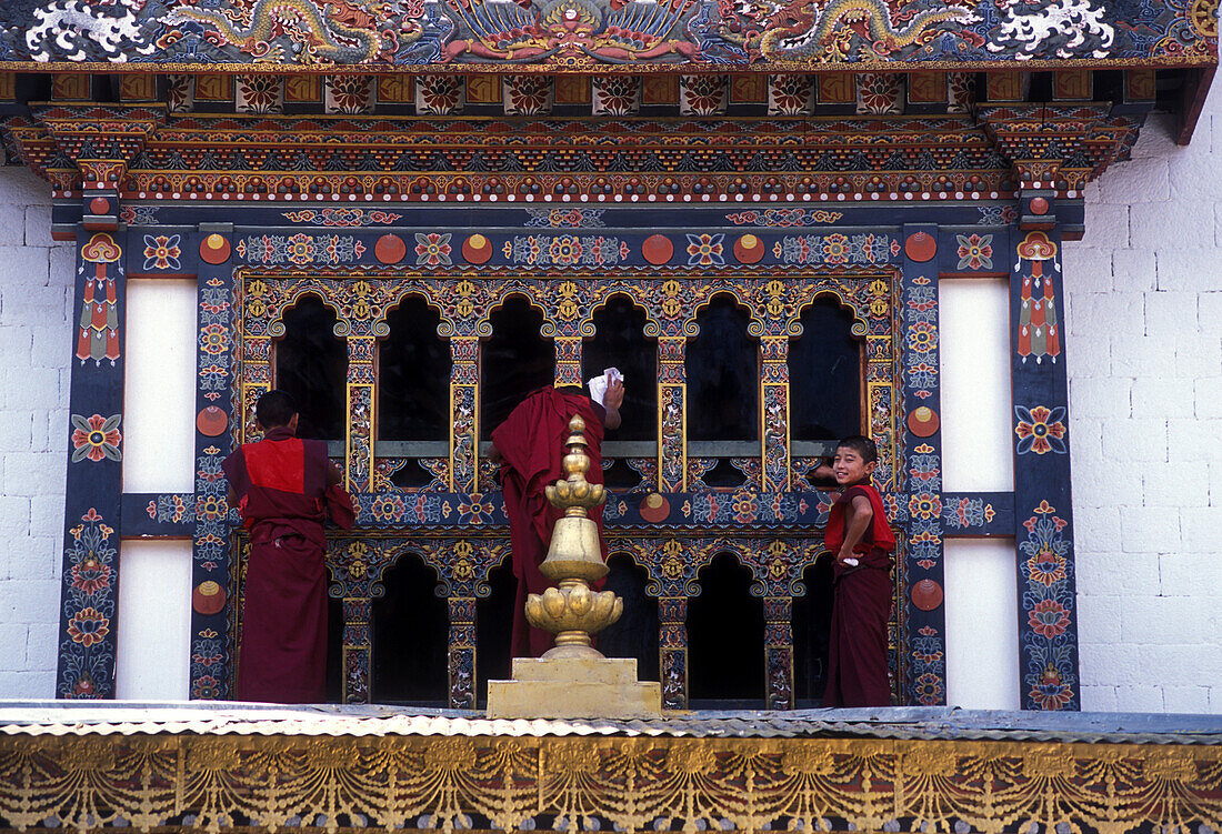 Young monks cleaning windows, Punakha Dzong, Bhutan
