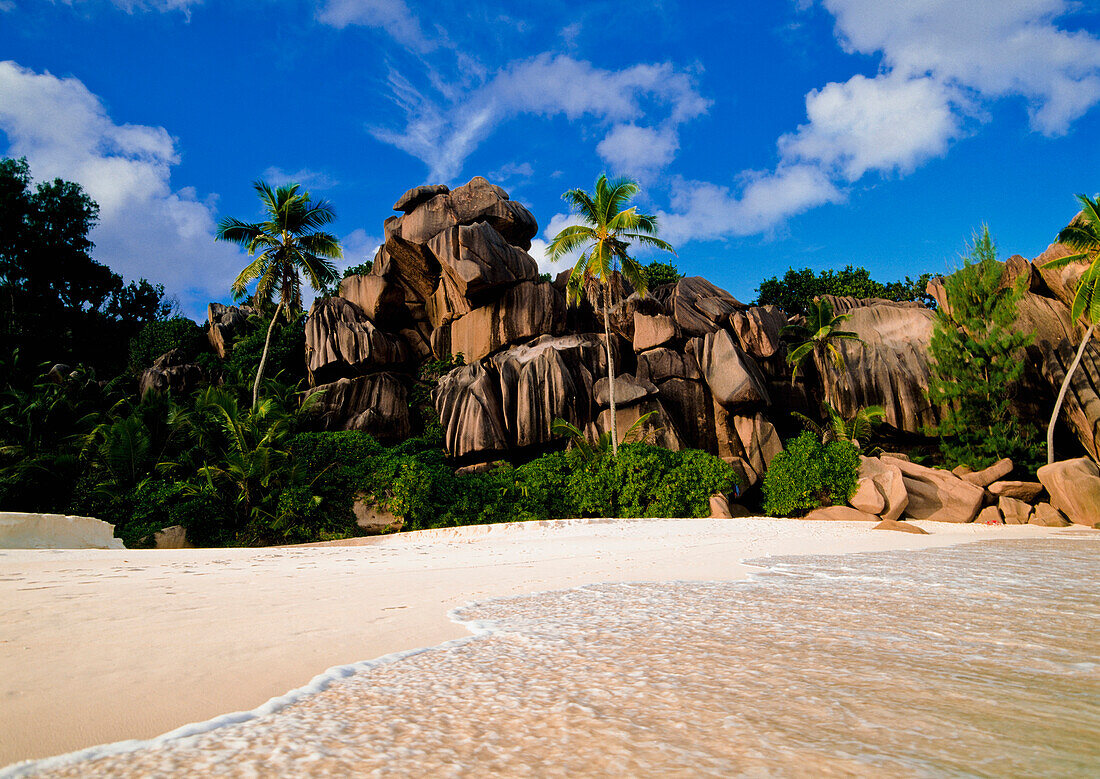 Rocky cliff on beach, Grand Anse, Seychelles