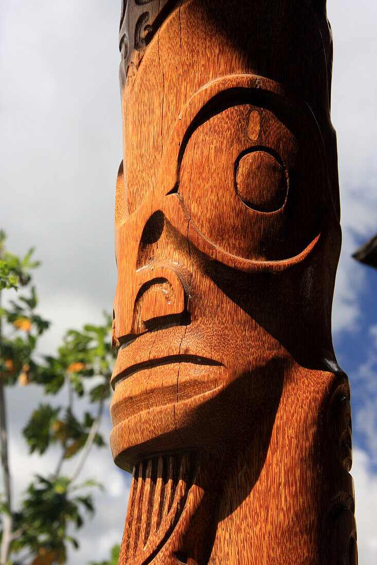 A wood carving on totem pole, Niku Hiva, Polynesia