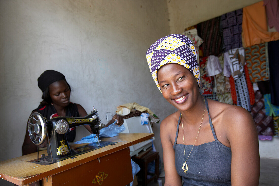 Smiling seamstress, Tanzania