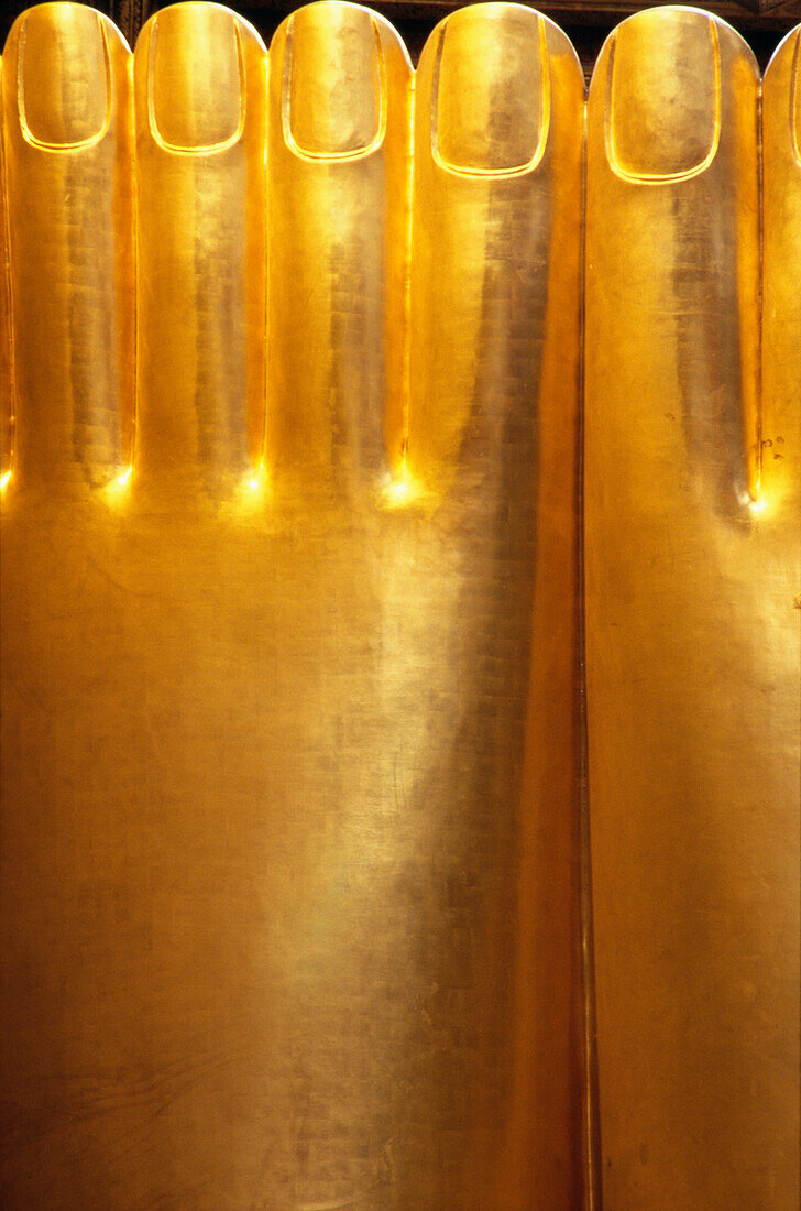 Feet of gold reclining Buddha, Wat Pho, close up, Bangkok, Thailand