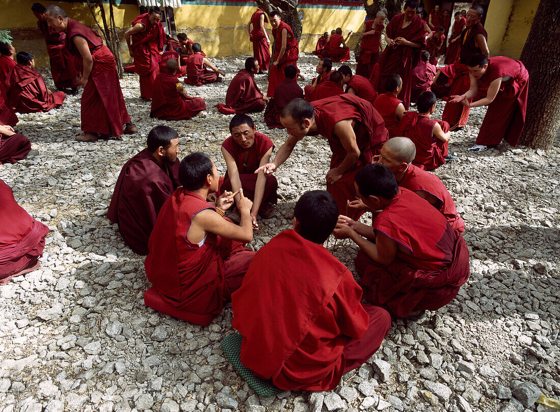 Monks debating on courtyard, Sera Monastery, Tibet