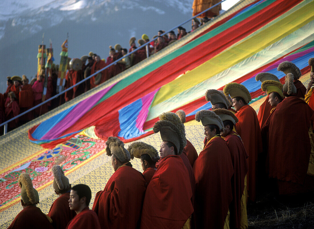 Giant thangka unveiling ceremony, Monlam prayer festival at dawn, Sertang Monastery, Langmusi, Amdo, Eastern Tibet