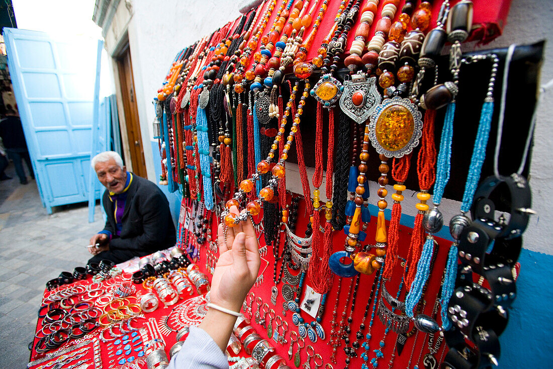 Female tourist at jewellery stall, Central Medina / Souq, Tunis, Tunisia, North Africa