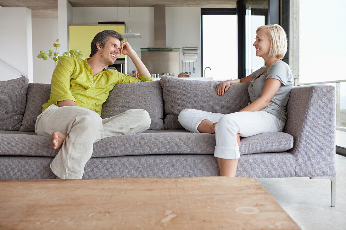 Couple having conversation in living room