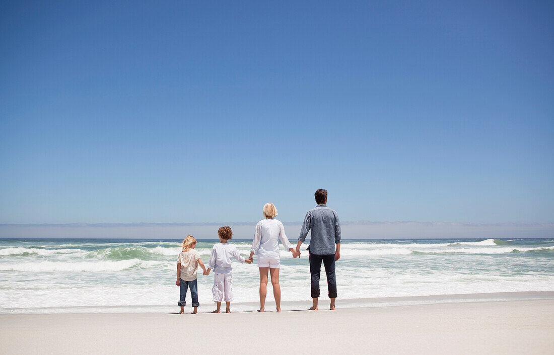 Family looking at sea view from beach