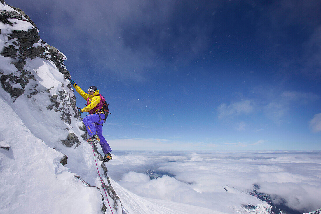 Mountaineer on the southwest ridge of Moench, Grindelwald, Bernese Oberland, Switzerland