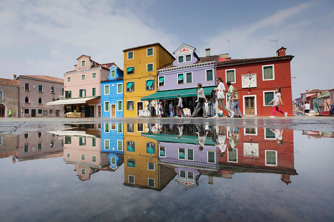 Row of colourful painted houses after rainfall, Burano Insland, Venice, Veneto, Italy