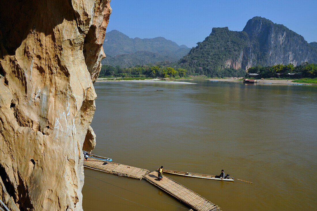 Bamboo footbridge, Buddha statues, Pak Ou caves, Mekong river, north of Luang Prabang, Laos