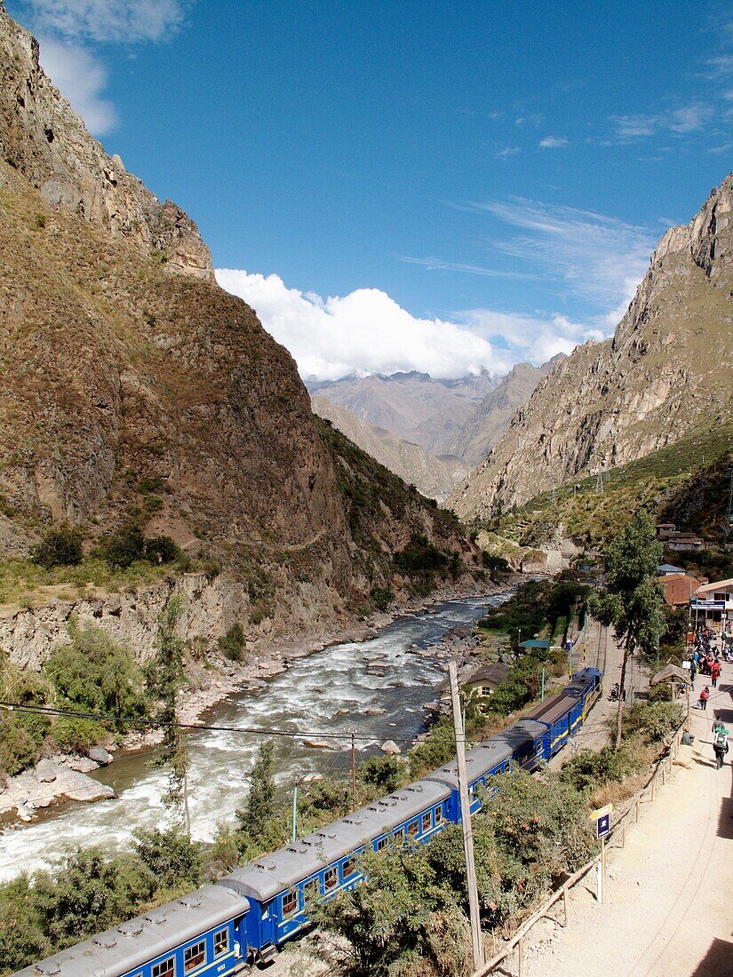 The PeruRail train line which runs from Cusco up the Rio Urubamba to Aguas Calientes or Machu Picchu Peublo and the ancient Inca ruins of Machu Picchu, Peru