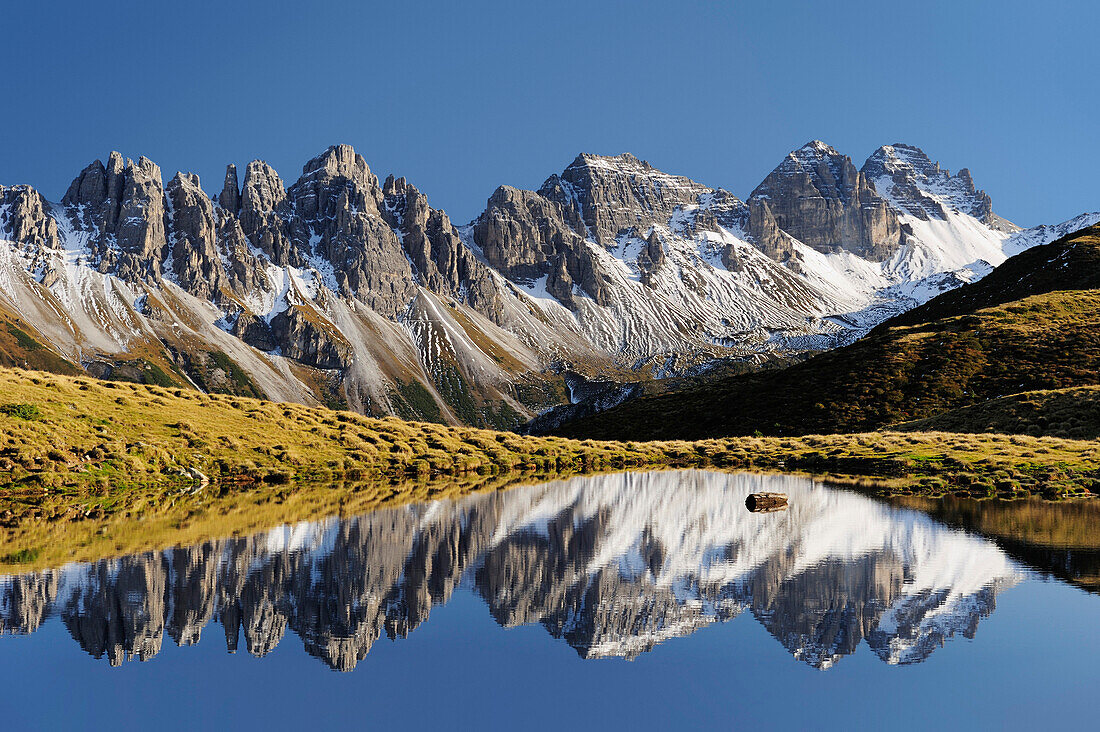 Kalkkoegel reflecting in a mountain lake, Salfains, Stubai, Stubai Alps, Tyrol, Austria