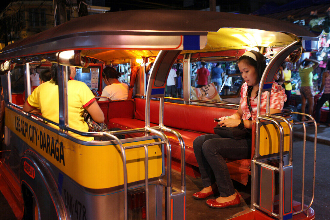 Young woman in a jeepney, Legazpi City, Luzon Island, Philippines, Asia