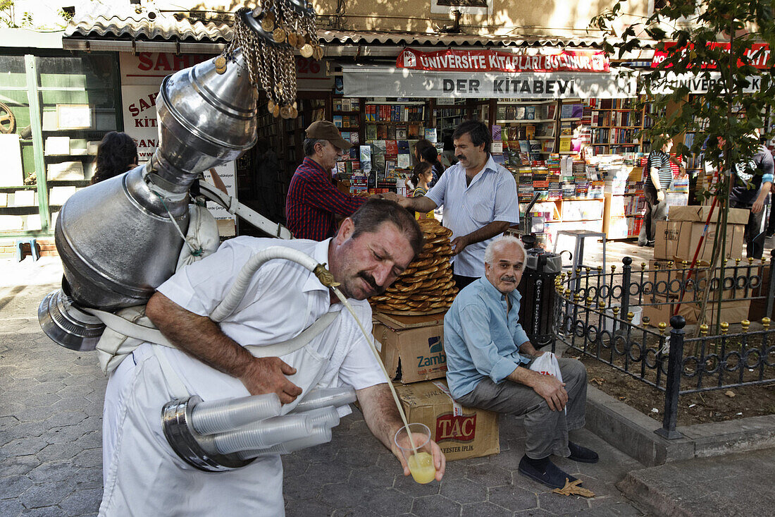 Juice seller in Grand Bazaar book market, Istanbul, Turkey, Europe