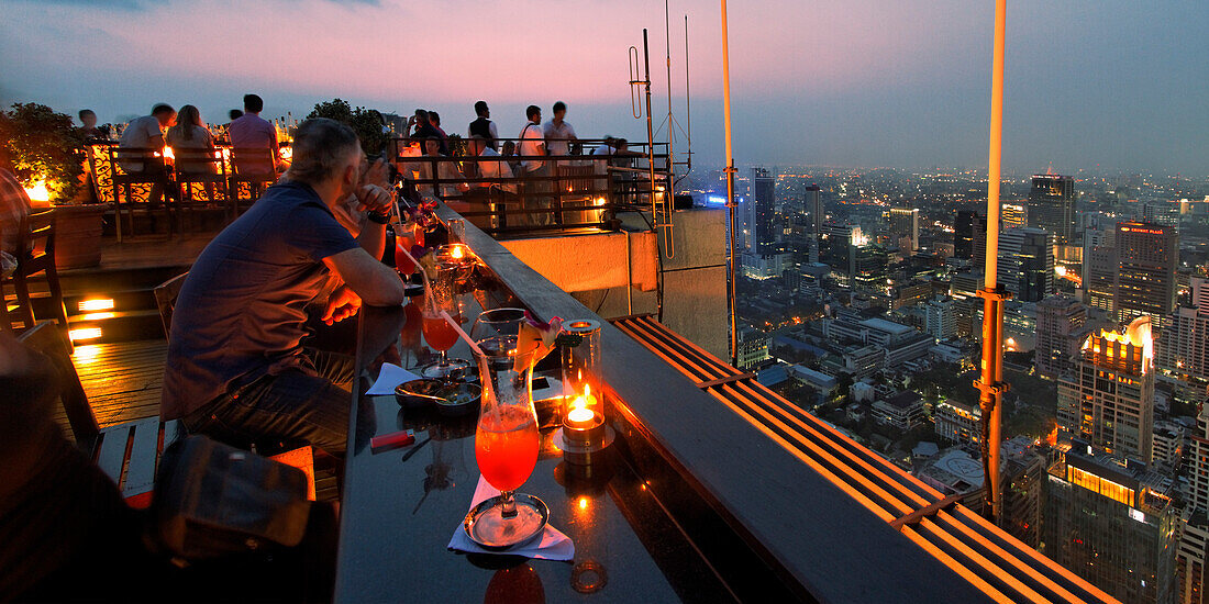 People at roof terrace of Banyan Tree hotel in the evening, Vertigo Bar, Bangkok, Thailand, Asia