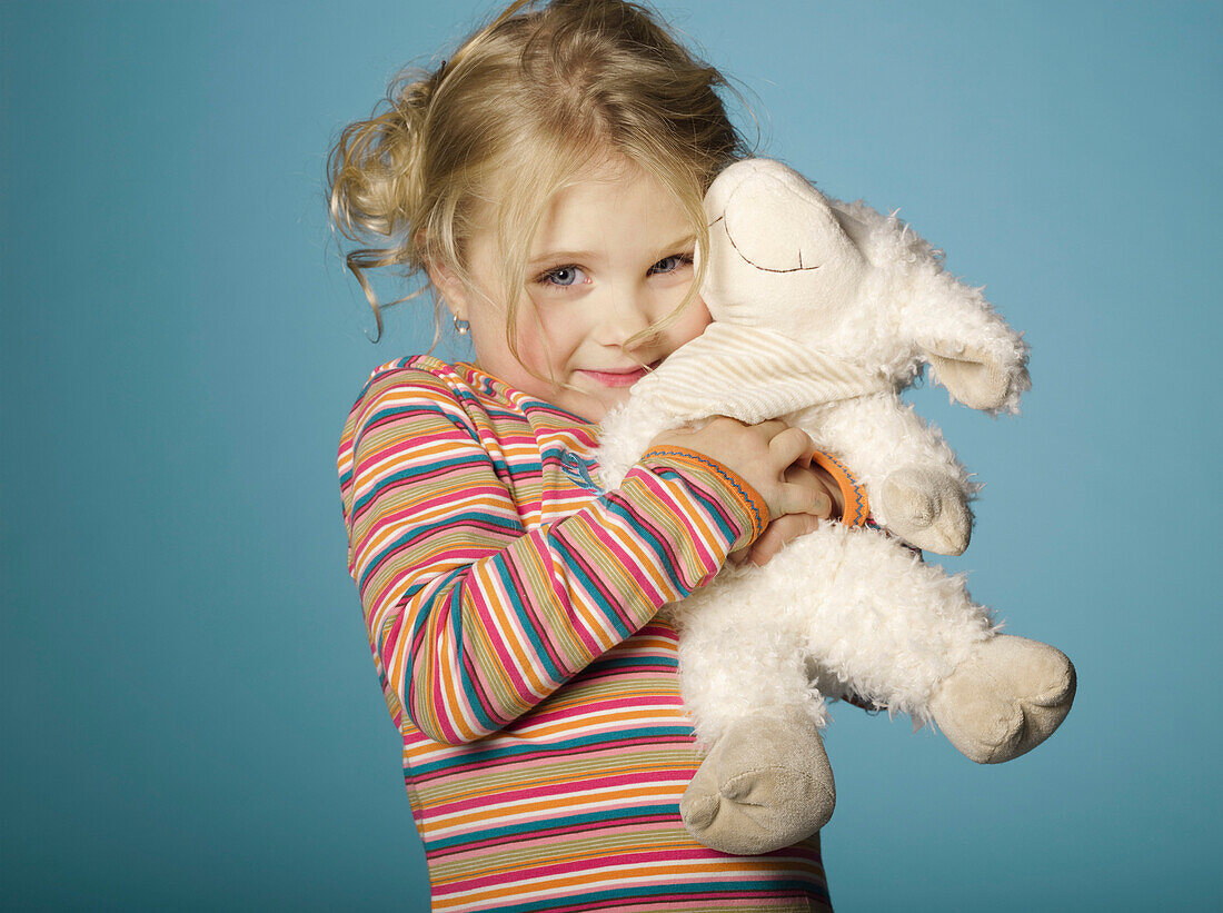 Portrait of little girl with stuffed toy