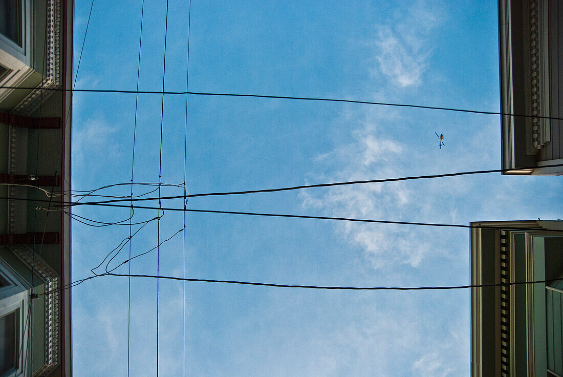 Roofs, Wires, Sky and Helicopter
