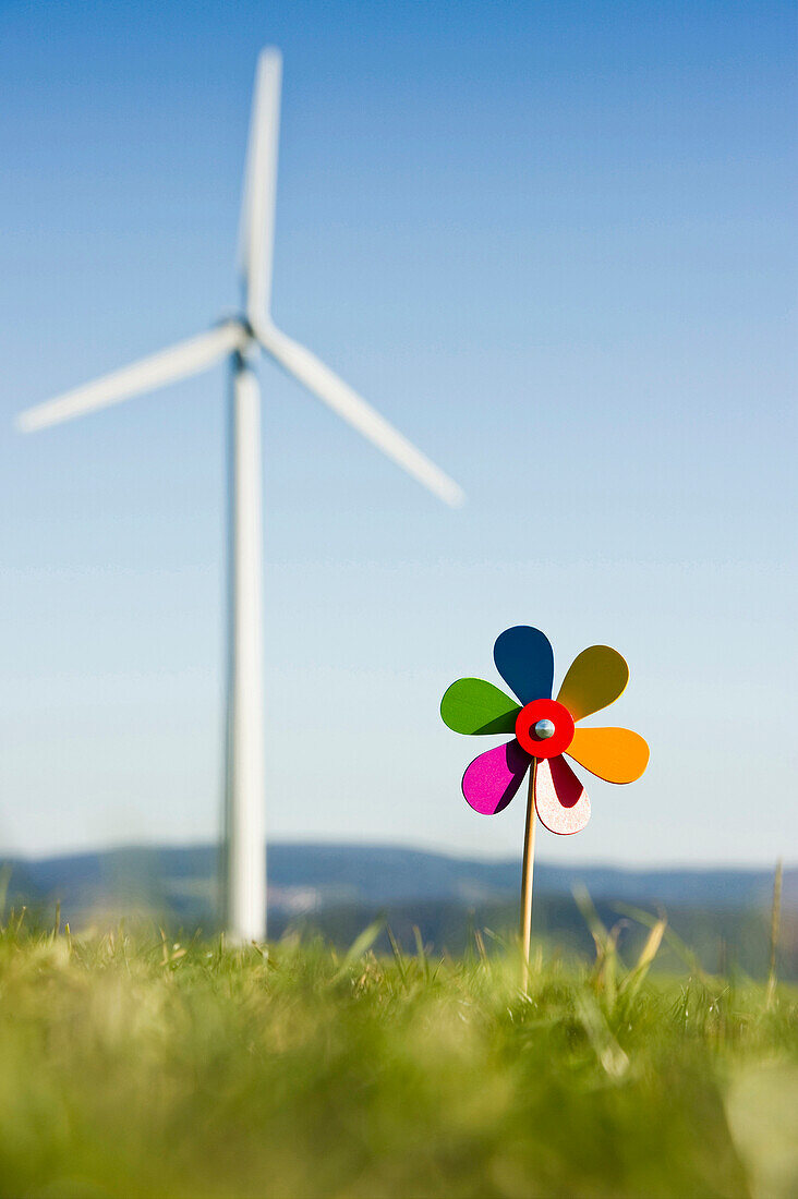 Toy windmill and large wind turbine, Black Forest, Baden-Wurttemberg, Germany