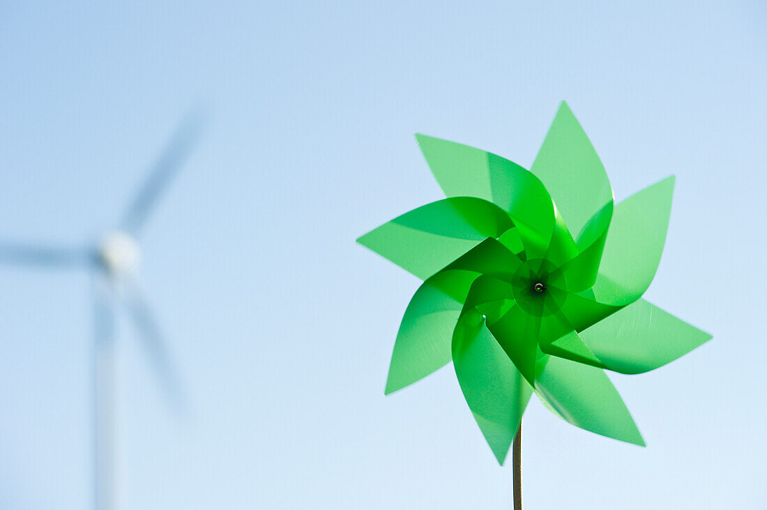 Toy windmill and large wind turbine, Black Forest, Baden-Wurttemberg, Germany