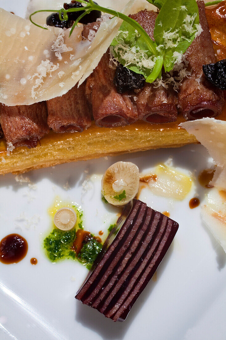 „Tarte fin“ of smoked tongue, black mushrooms in soy pickle, mushroom „A la greque“, grated pecan nuts, condiment of Shiraz and pickled tongue, La Colombe, Constantia, Cape Town, Western Cape, South Africa, RSA, Africa