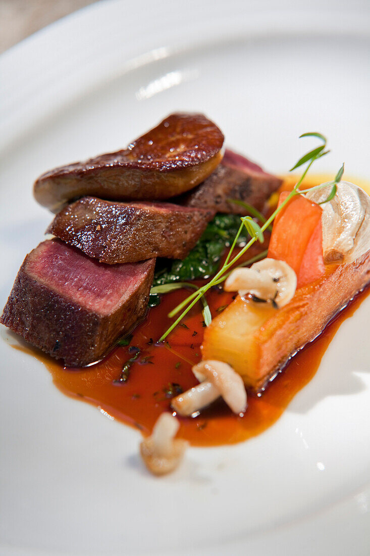 Pan-fried loin of springbok, port and fig jus, „pommes fondant“, fricassee of roasted garlic, wild mushrooms and fig, La Colombe, Constantia, Cape Town, Western Cape, South Africa, RSA, Africa